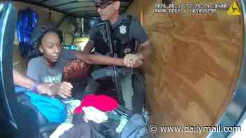 Incredible moment two young girls are rescued from sweltering trailer after being abducted by babysitter