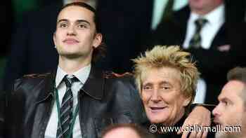 Rod Stewart, 81, appears in great spirits as he cheers alongside his son Alastair at Celtic football match after cancelling his tour following a routine coronary stent procedure