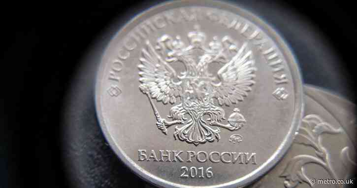 Russians are pulling billions from banks over fears Putin will raid their savings