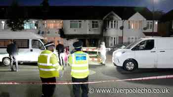 Murder probe after woman dies and 8 others rushed to hospital in house fire