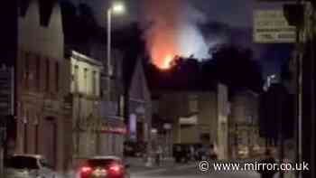 Body found after fire rips through factory as murder detectives launch investigation