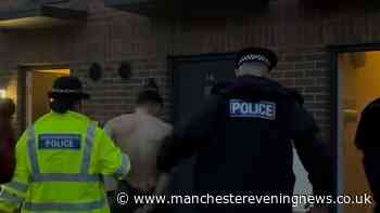 Police turn up on Salford street at 5am and storm new flats with six arrested