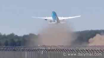 Boeing passenger jet's tail hits the ground on take-off after plane carrying 287 mysteriously braked and ran off German runway in 'near disaster'
