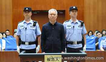 Chinese court sentences founder of troubled property developer Evergrande to life in prison