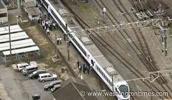 Express train hits and kills 4 workers at a railway station in Japan