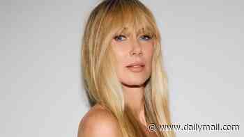 Kimberly Stewart, 47, flashes bare bump as she announces she is expecting third child... as father is not revealed