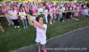 Women in pink rally in support of Lindsay Clancy who is on trial for killing 3 children