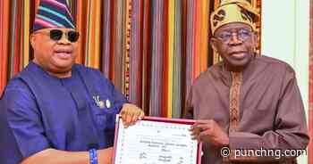 PHOTOS: Adeleke presents return certificate to Tinubu
