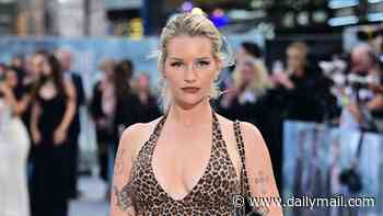Lottie Moss turns heads in a plunging leopard print unitard as she attends the world premiere of The Dog Stars
