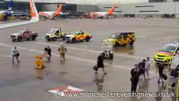 EasyJet plane met by fire engines at Manchester Airport as passengers taken off flight