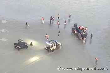 Footage shows migrants attacking French police trying to stop small boat crossing to UK