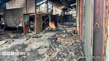 Police investigate grass fire which destroyed businesses
