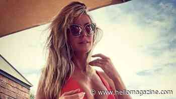 Heidi Klum goes topless in racy vacation photo as she showcases jaw-dropping figure
