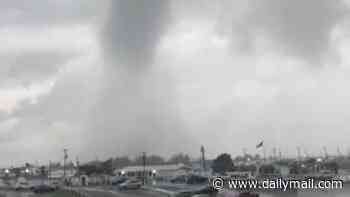 Apocalyptic waterspout in New York as three of America's biggest airports crippled amid TORNADO and flood chaos