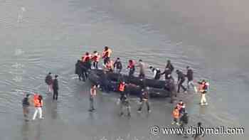 Violent migrants clash with police as they try to set sail for the UK from French coast