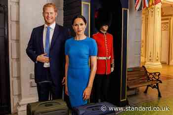 Harry and Meghan waxworks pose with suitcases and royal guard to mark UK return