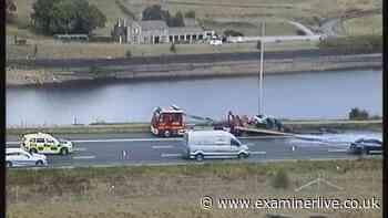 M62 car fire LIVE updates as driver face long delays as traffic builds