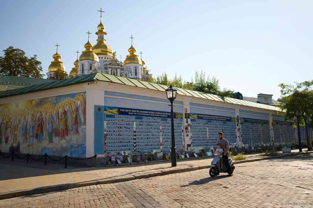 Russian drones kill 14 people at a shopping mall in a central Ukrainian city, officials say