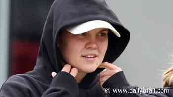 Cricketer Georgia Voll keeps a low profile as she returns to Australia following explosive cheating scandal