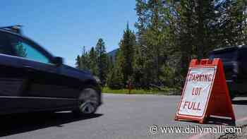 Terrible parking lot etiquette rocks America's ritziest mountain town as hikers get up at crack of dawn to take on famed trail
