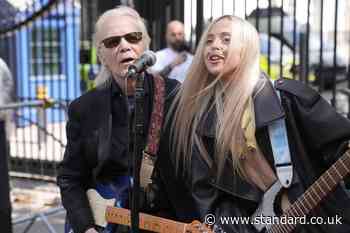 Brian Hyland performs outside Downing Street for NHS campaign