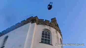 Reckless thrillseekers ignore police warnings to plunge into sea from children’s charity roof