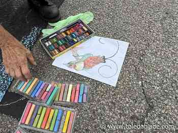 Michigan residents cover street with chalk before afternoon washout
