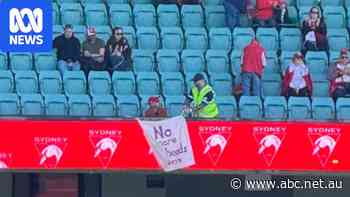 Live: Security removes banner, as record crowd attends Swans AFLW game