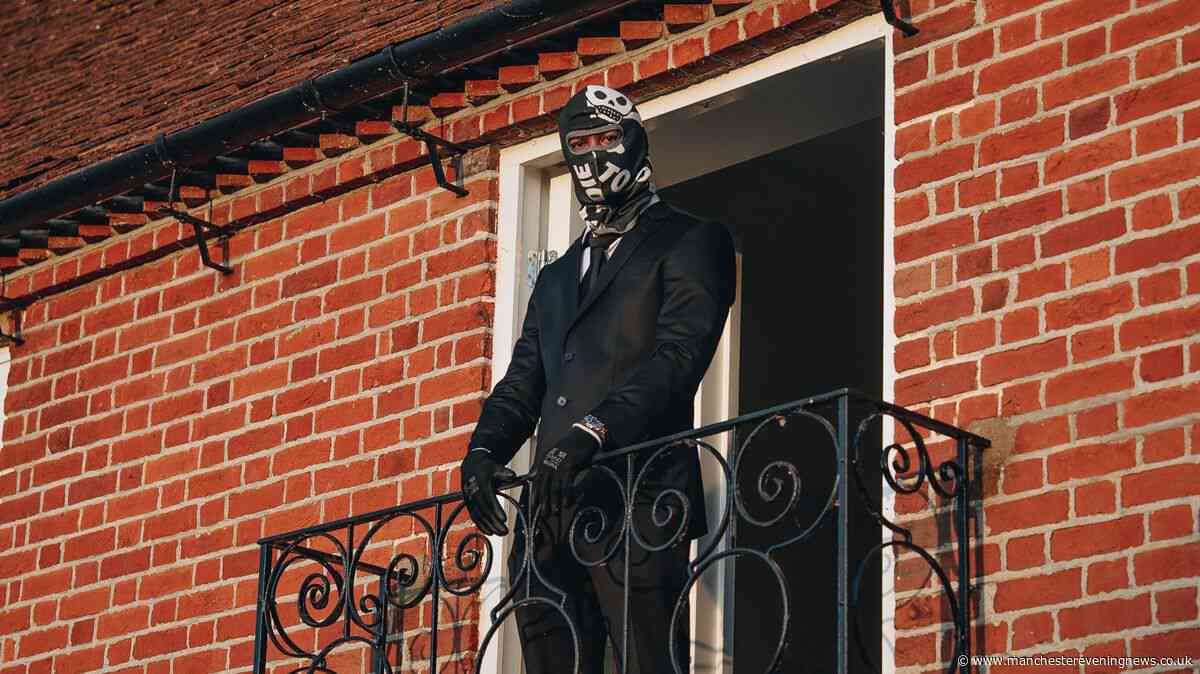 The masked Moss Side rapper who signed a record deal from his prison cell