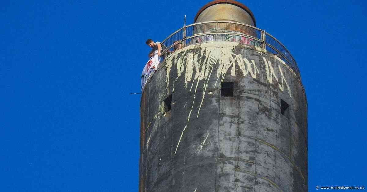 Teen photographer snaps pair unfurling banner at top of Bankside Chimney
