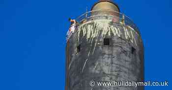 Teen photographer snaps pair unfurling banner at top of Bankside Chimney