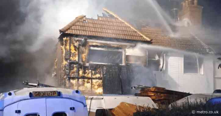 Car destroyed and huge hole left in roof after London house fire