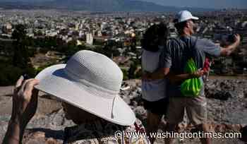 The sunhat is everywhere in Athens as crowds grow larger at ancient sites