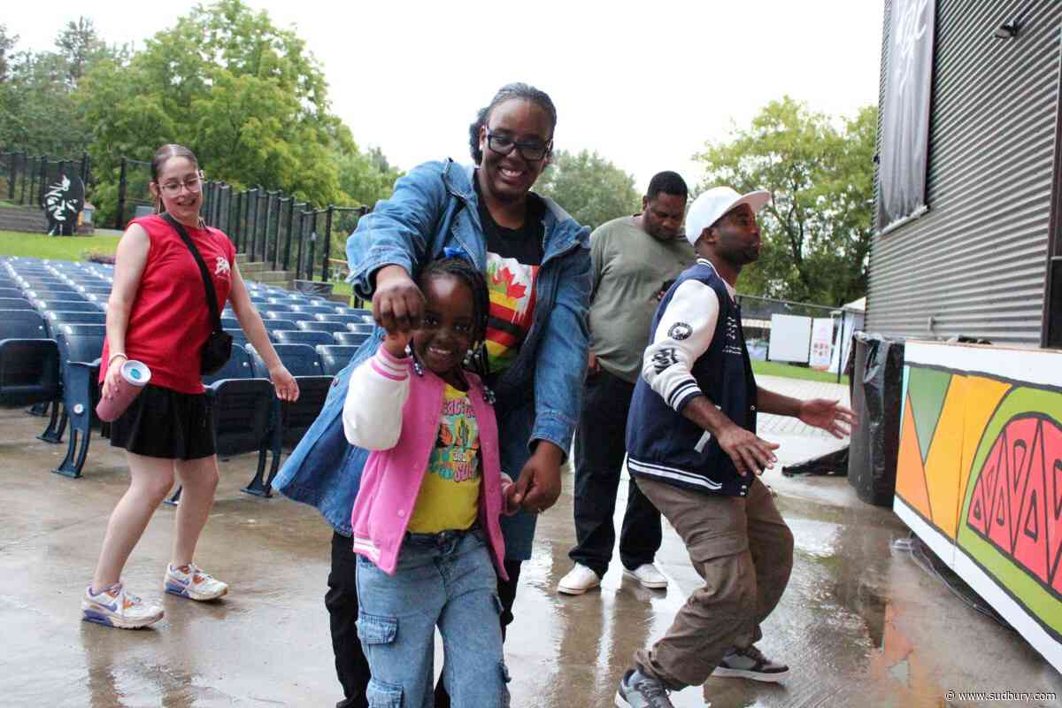 Photo: Grooving in the rain at AfroFest Sudbury