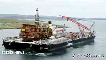 World's largest heavy lift vessel carries oil platform to Shetland