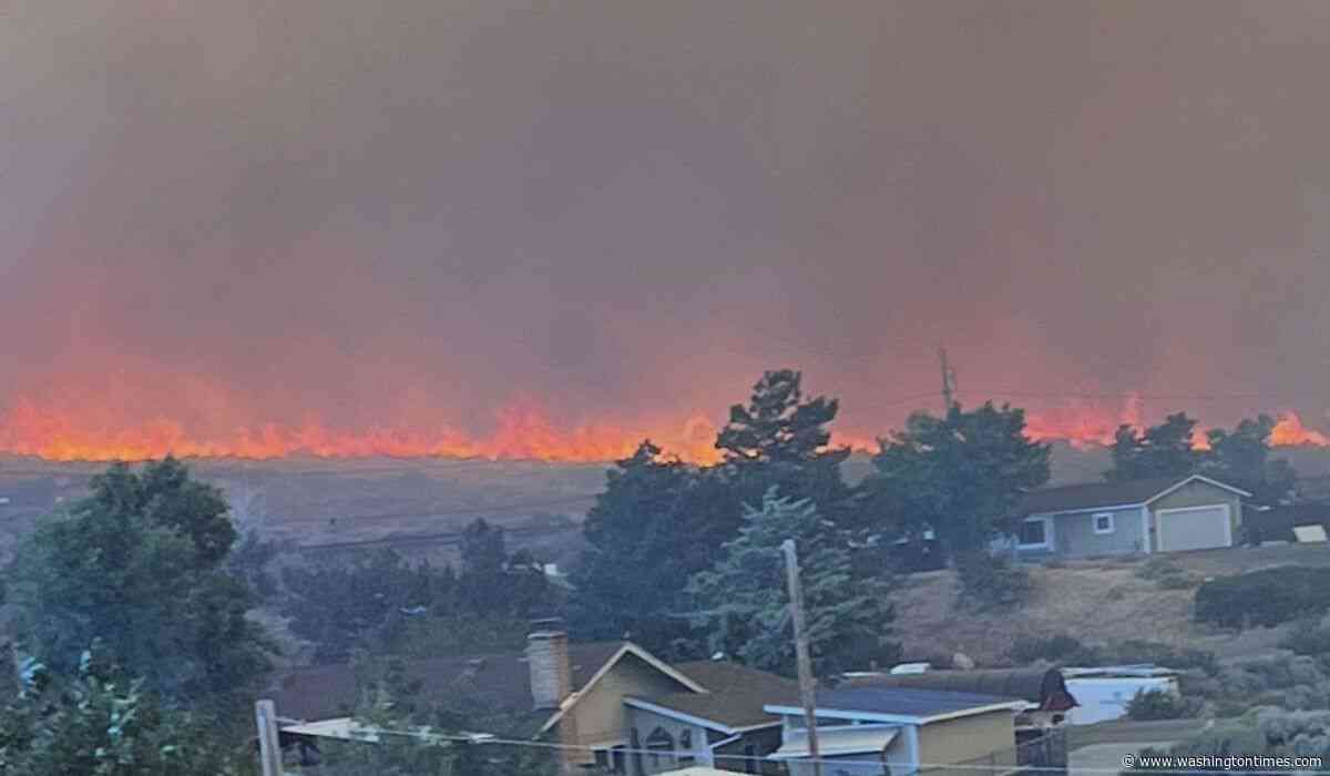 Wildfire approaches Reno, Nevada, forcing thousands to evacuate their neighborhoods