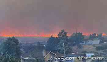 Wildfire approaches Reno, Nevada, forcing thousands to evacuate their neighborhoods