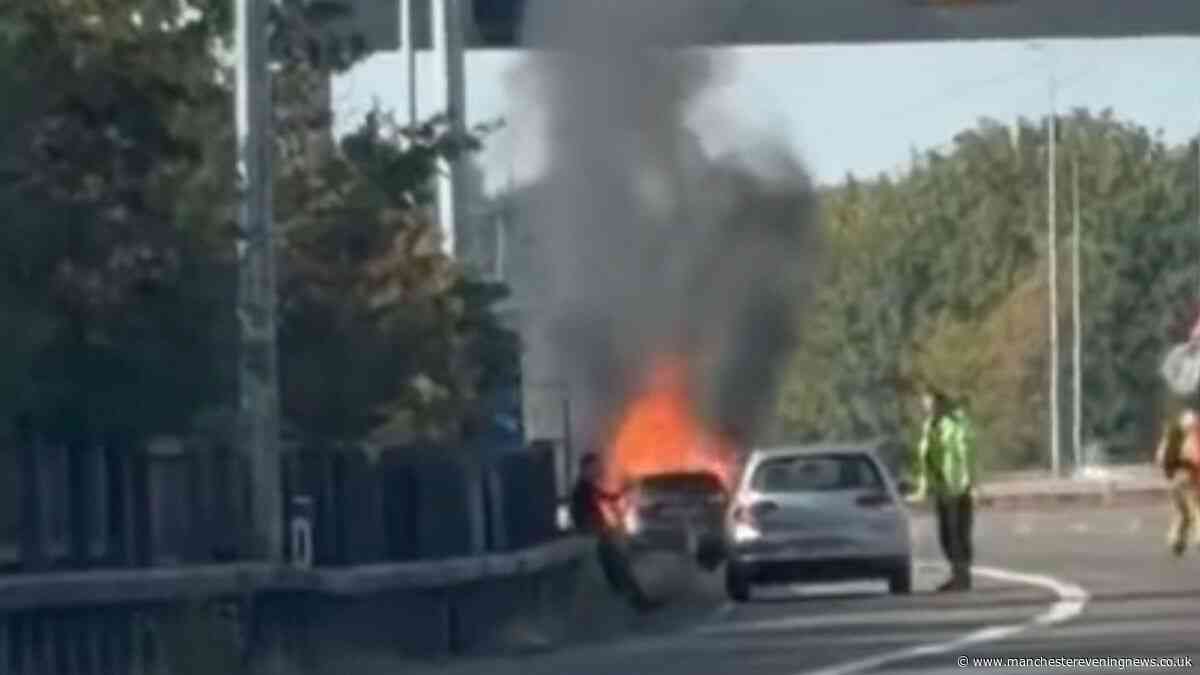 Fire crews rush to M60 scene after car bursts into flames on the motorway
