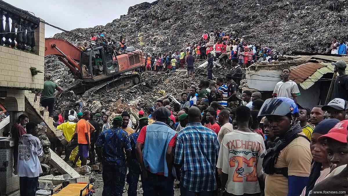Massive garbage heap collapses onto homes, killing at least 30 as rescuers search for survivors