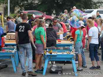 Dozens help build beds for children in need during St. Paul's annual Party in the Parking Lot