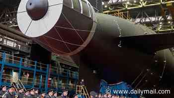 Putin's newest submarine - designed to carry Poseidon doomsday weapon 'which can unleash tsunamis' - launches for the first time
