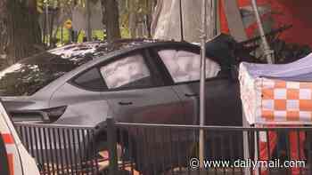 Woman, 27, is killed and two more people injured after Tesla crashes into diners at a Westfield shopping centre