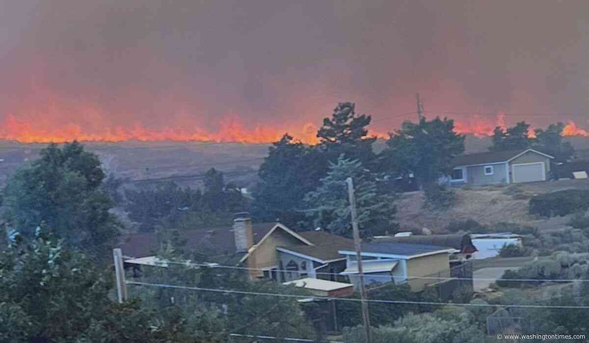 Fast-moving wildfire amid shifting winds threatens Reno, Nevada, forcing thousands to evacuate