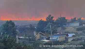 Fast-moving wildfire amid shifting winds threatens Reno, Nevada, forcing thousands to evacuate
