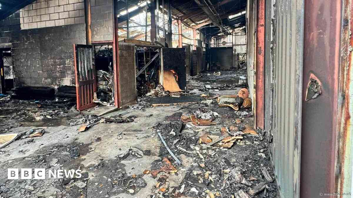 Teenagers arrested after fire destroys businesses