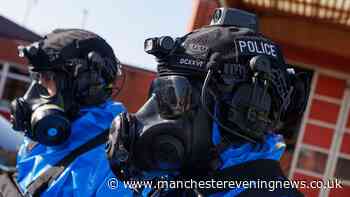 Police in haz-mat suits swarm Stockport street after 'liquid drugs lab' arrests
