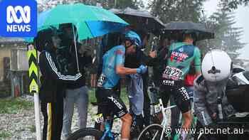 Cyclists run for cover as hailstorm forces La Vuelta stage cancellation