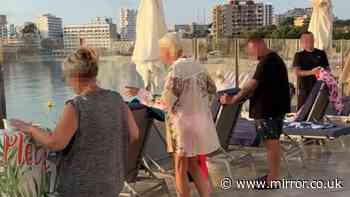 Sunbed wars at Mallorca hotel sees tourists scramble by poolside as early as 6am