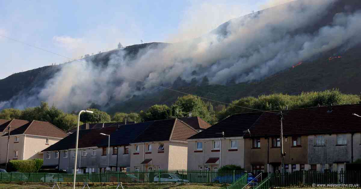 Smoke cloaks mountainside as wildfire rages above homes in Maerdy