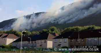 Smoke cloaks mountainside as wildfire rages above homes in Maerdy
